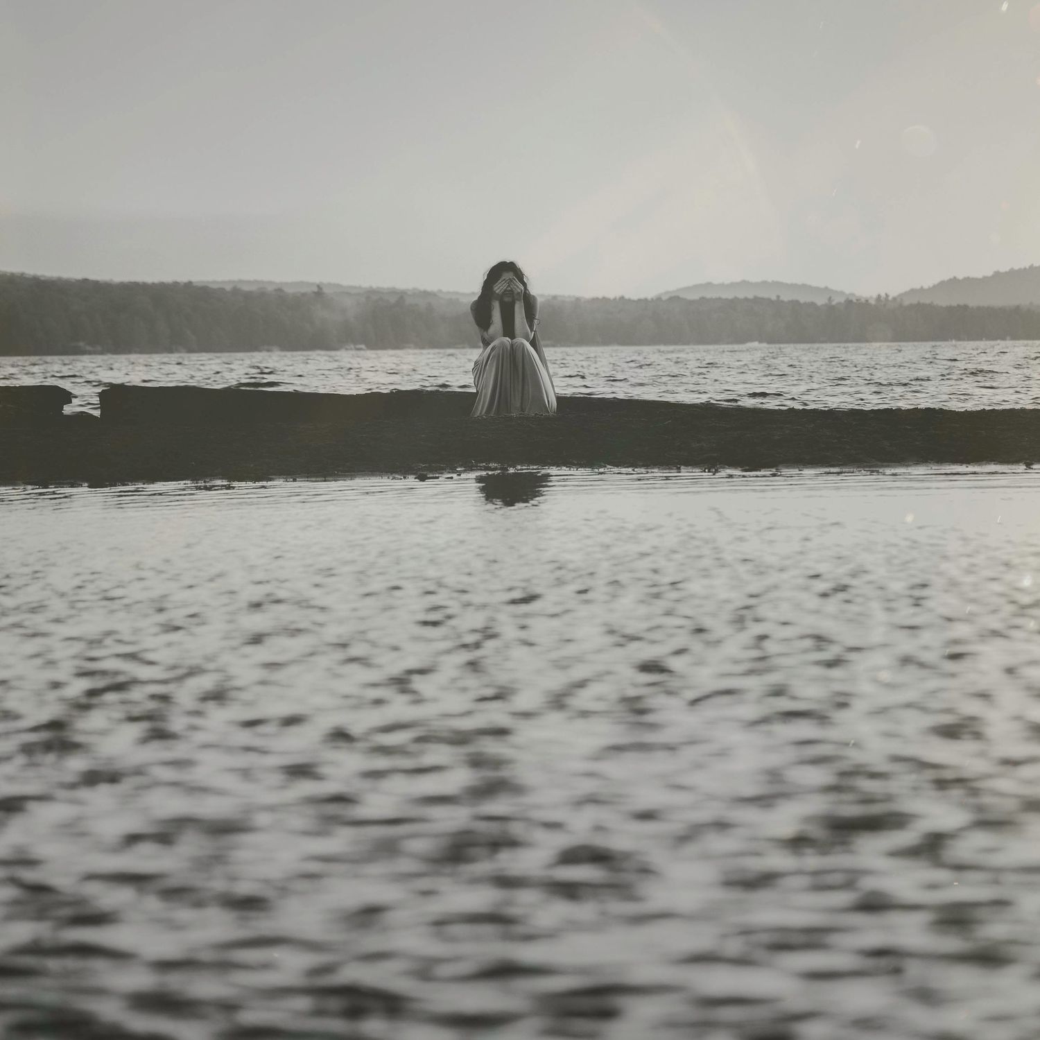 Black and white water landscape with dramatic ripples and reflections.