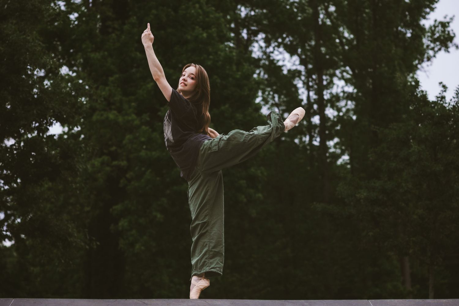 Series of dramatic jumping poses captured against green forest background.