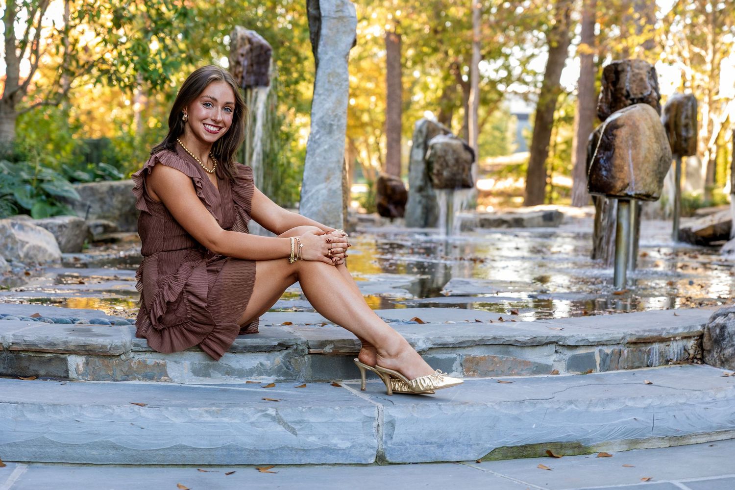 Multiple outdoor photos showing casual poses on stone steps in a park-like setting during late afternoon.