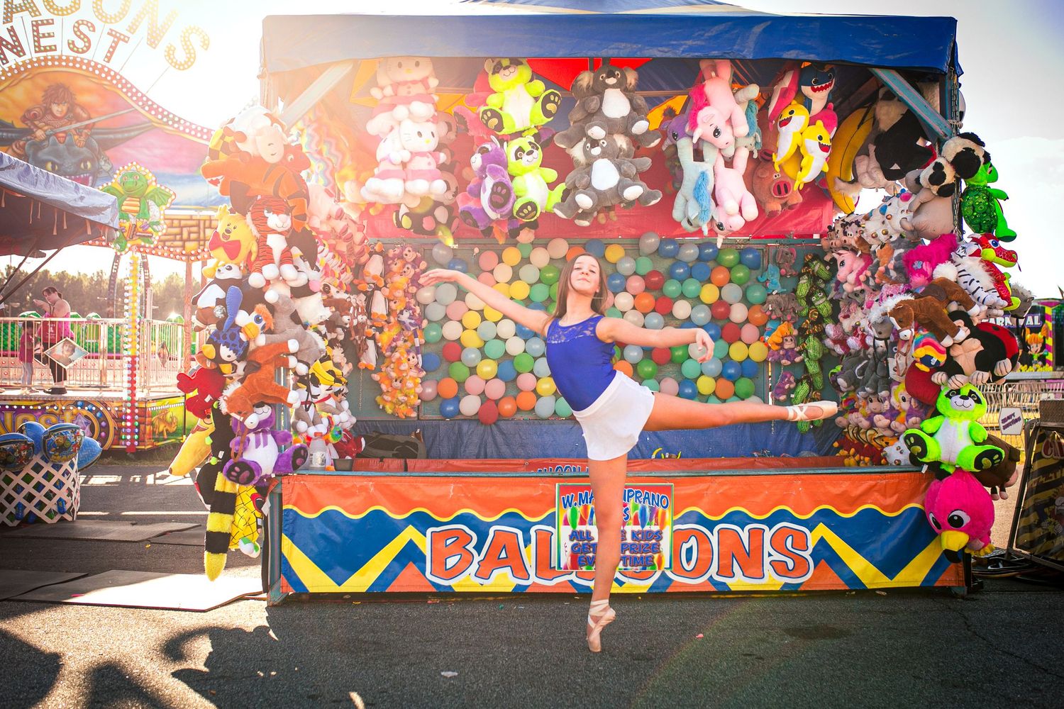 Vibrant carnival wall art with colorful graffiti style designs and text.