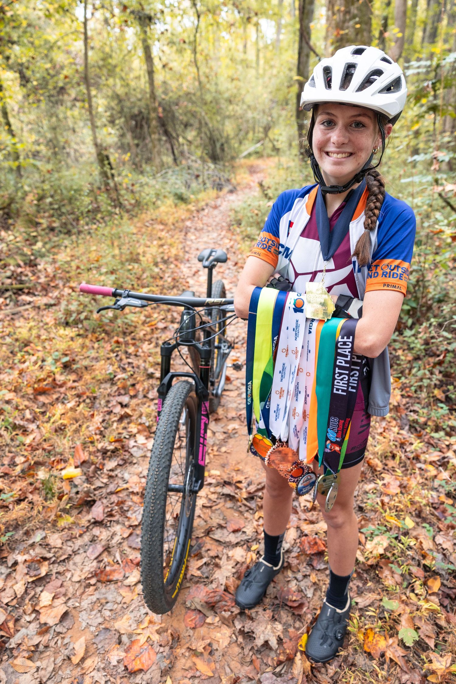 Mountain biking photos showing bikes and gear on autumn forest trail.