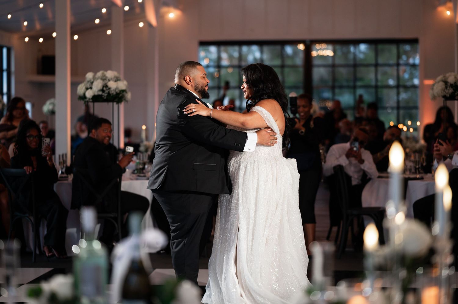 Husband & wife enjoying the first dance together, captured by the best photographers in South Florida.