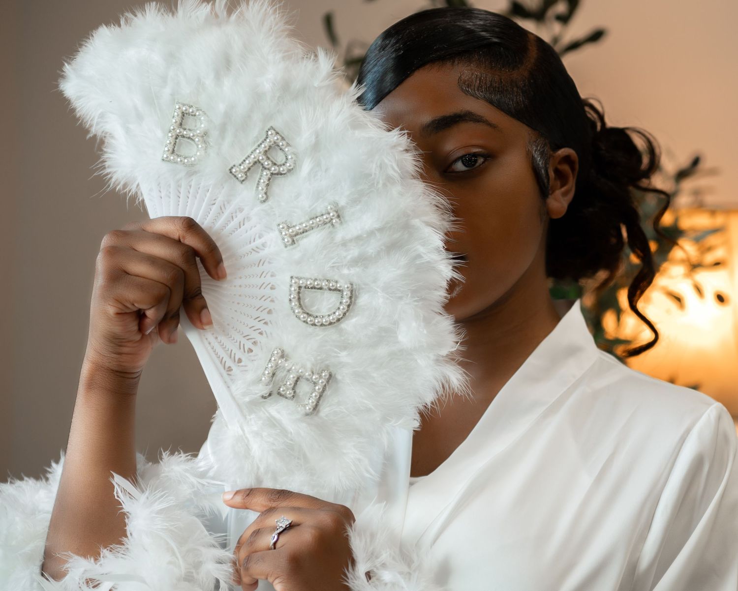 Destination wedding photographers in Florida travelled to Lexington, Kentucky, to photograph this beautiful bride holding her feather fan.
