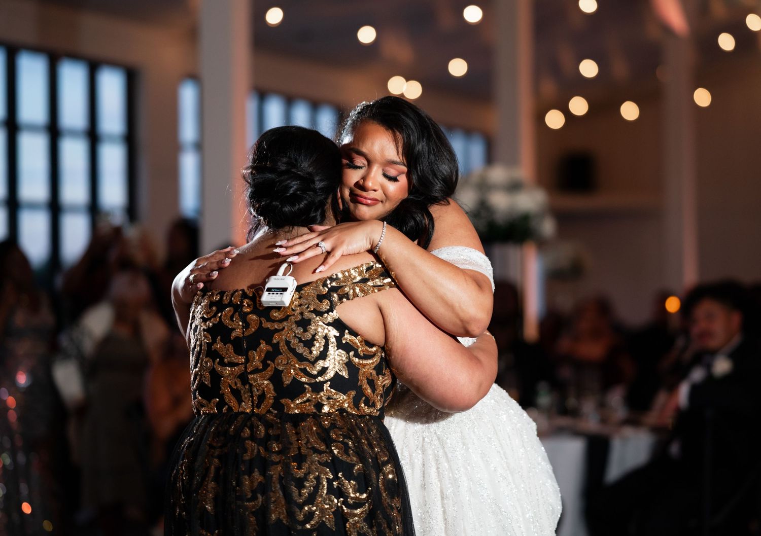 South Florida wedding photographers captured the embrace of a mother and daughter during their dance.