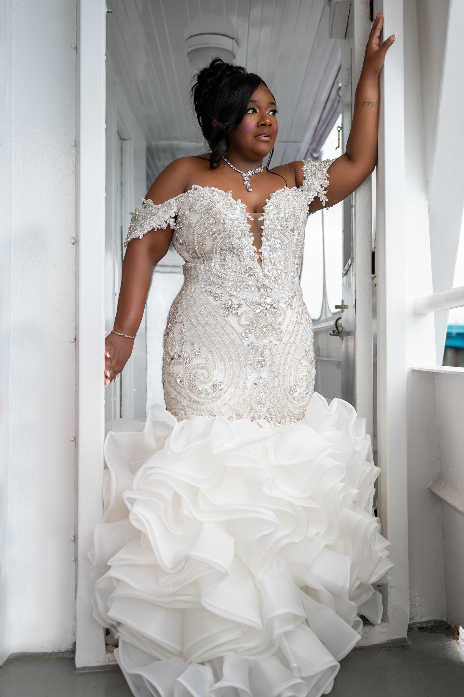 Bride in shoulderless white gown with ruffled train on Fort Lauderdale yacht wedding deck