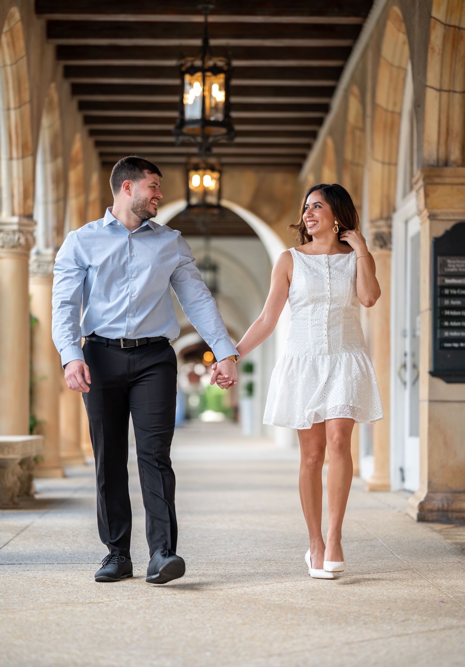Romantic walking photo of couple at Worth Avenue engagement session