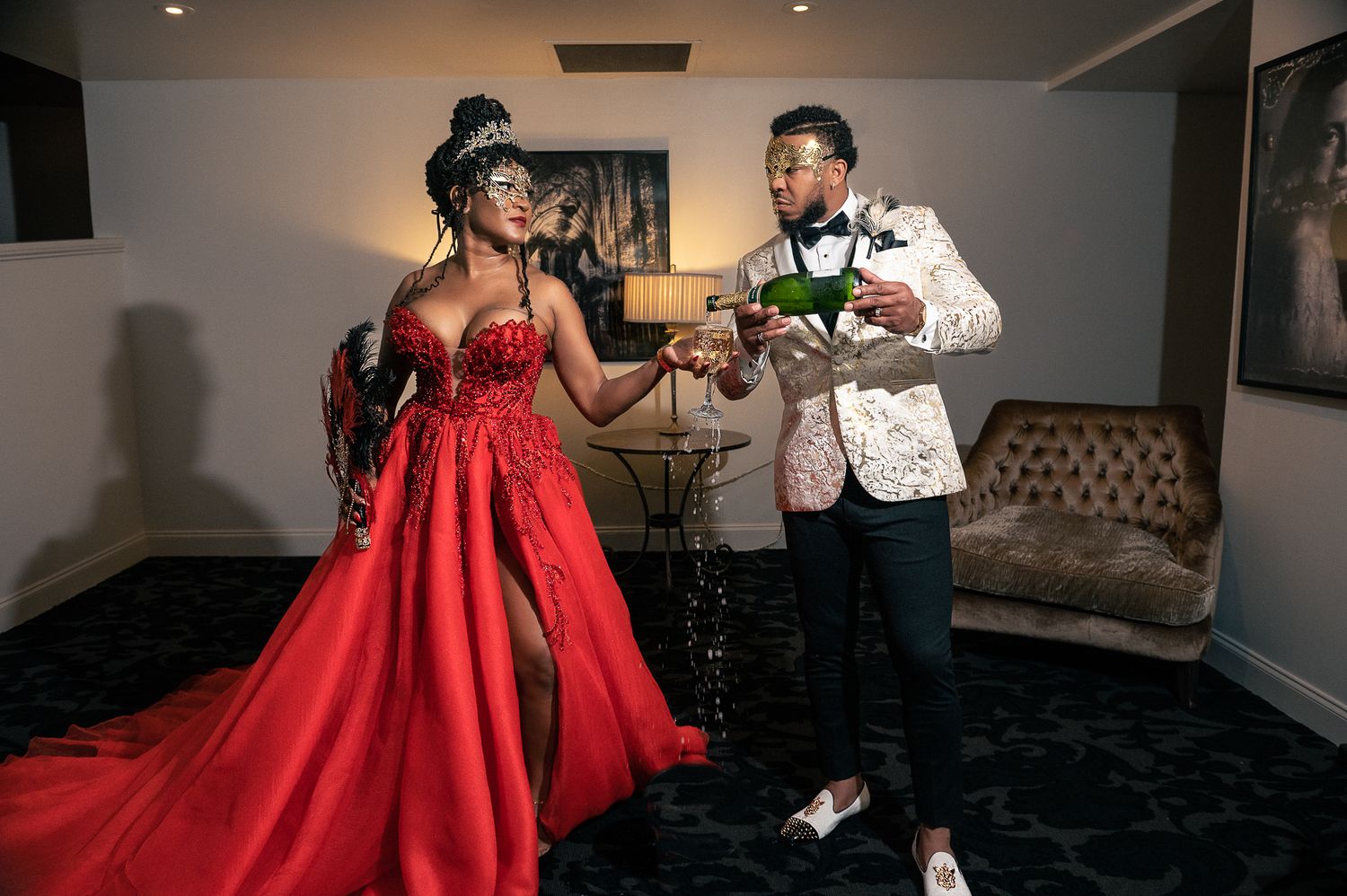 The groom pours his bride a glass of champagne at the luxury hotel. Beautiful South Florida destination wedding photography.