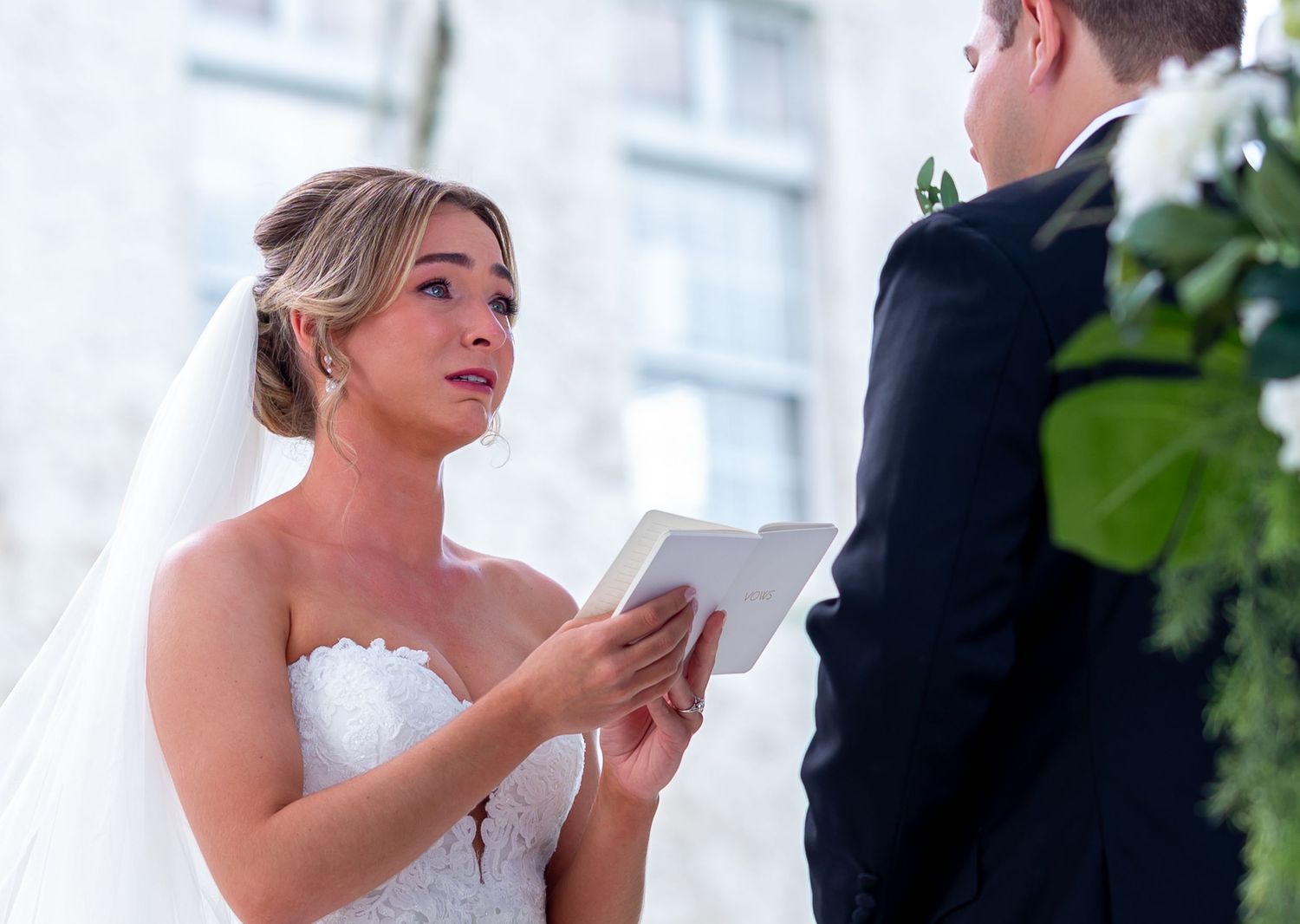 The bride cries as she reads her vows to her groom during the first look captured by the best Wellington luxury wedding photographers.
