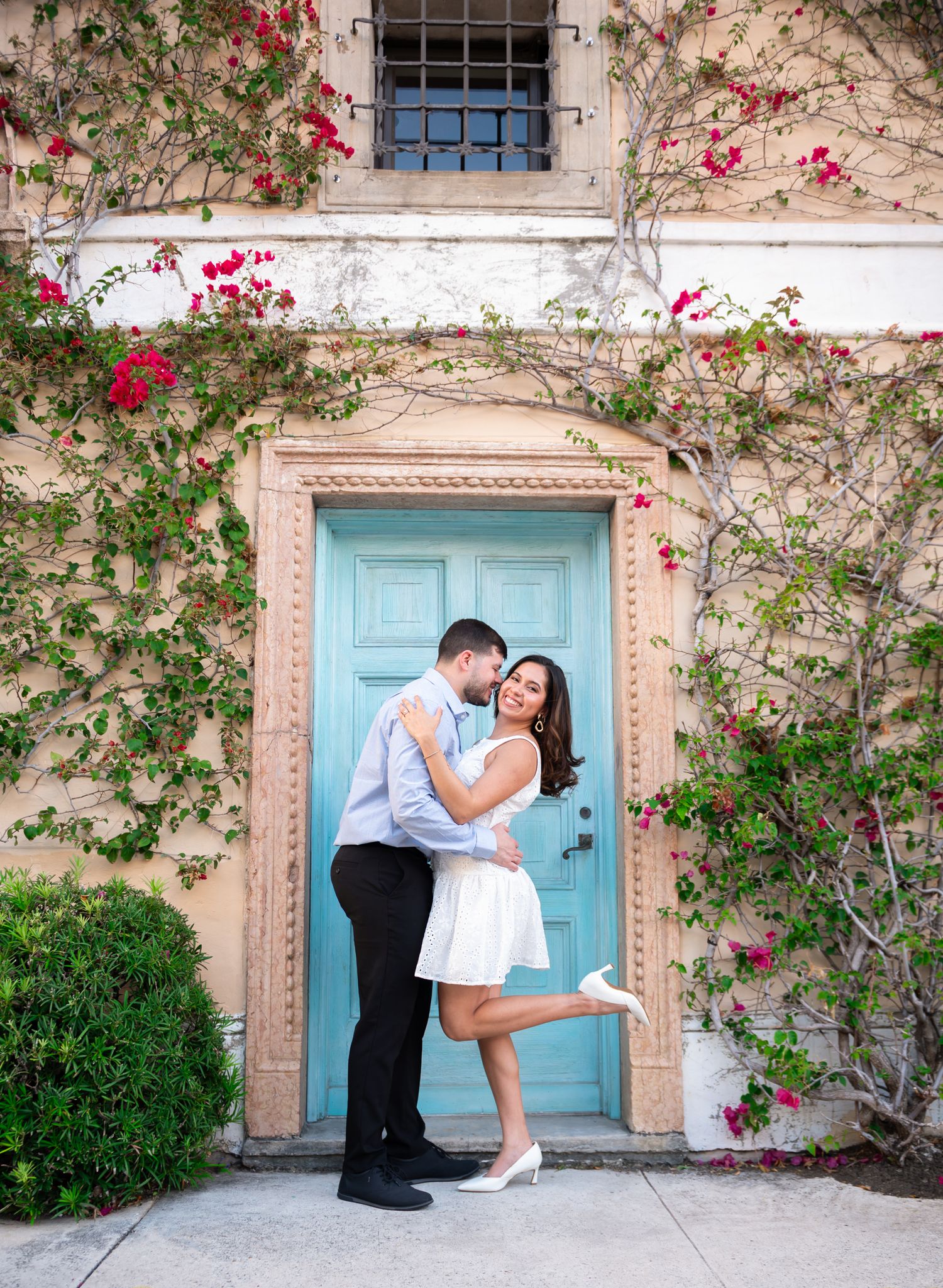 This couple was photographed in front of the turquoise door on Peruvian Avenue in Palm Beach by Worth Avenue engagement photographers.