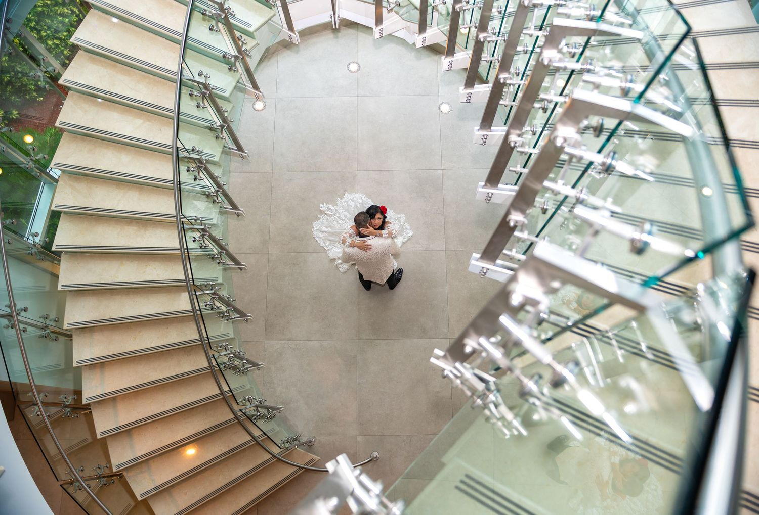 Beautiful shot from above of the bride and groom taken by Orlando wedding photographers during cocktail hour in Orlando, Florida.