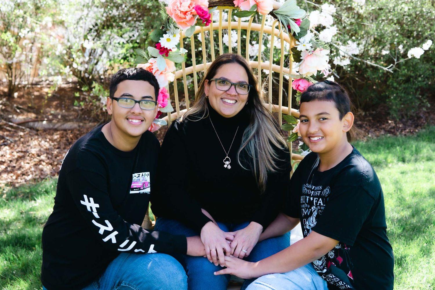 A mother and her boys with a candied portrait.