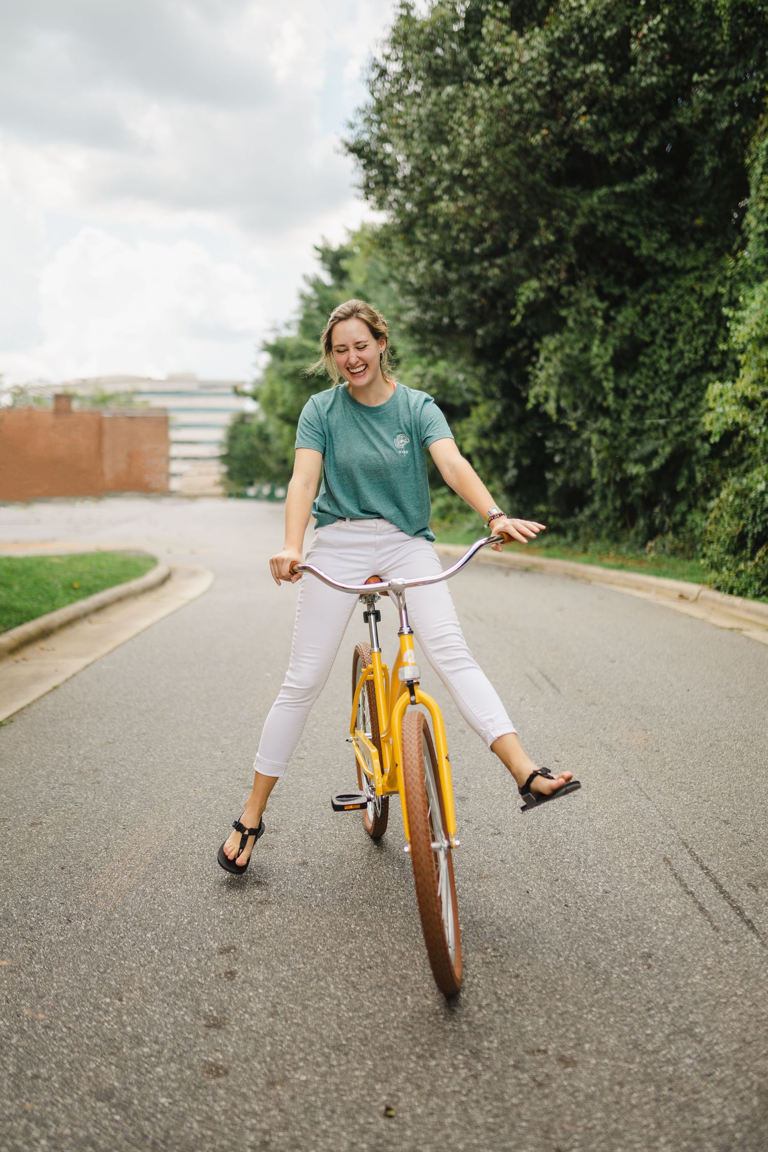 Girl riding a yellow bicycle on a sunny day
