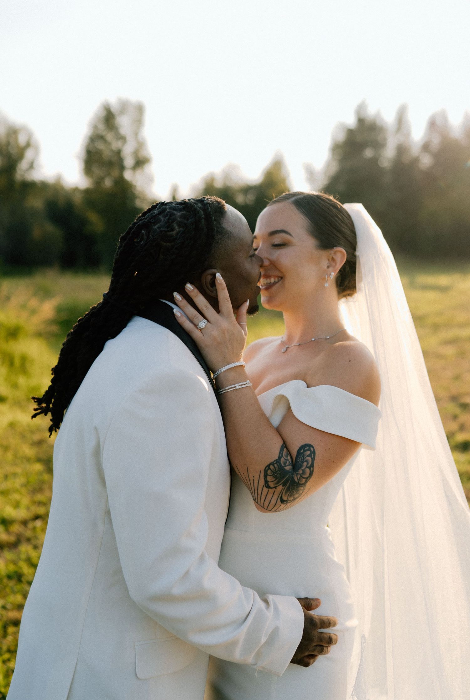 a bride and groom pulling their faces together