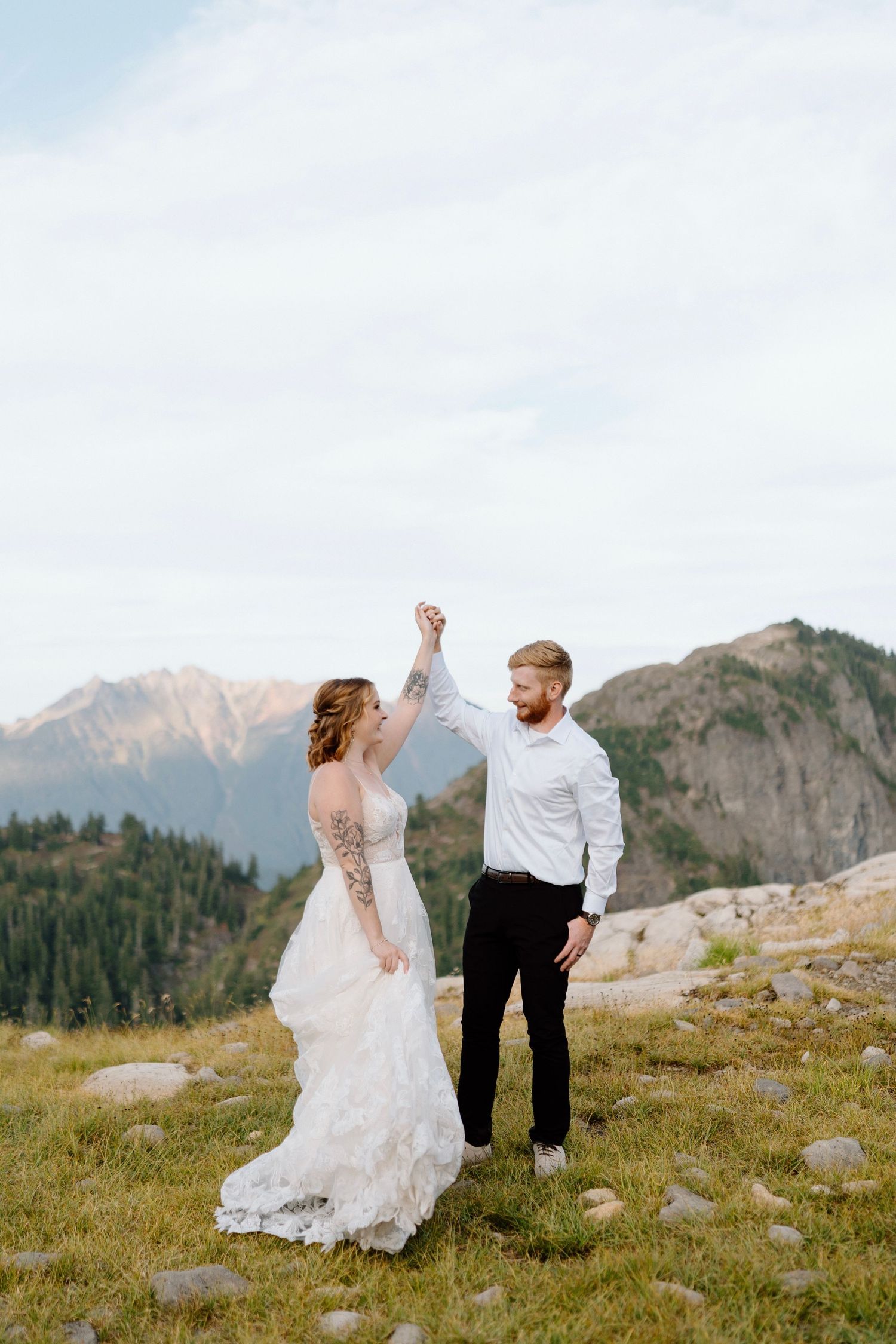 a groom is twirling his bride