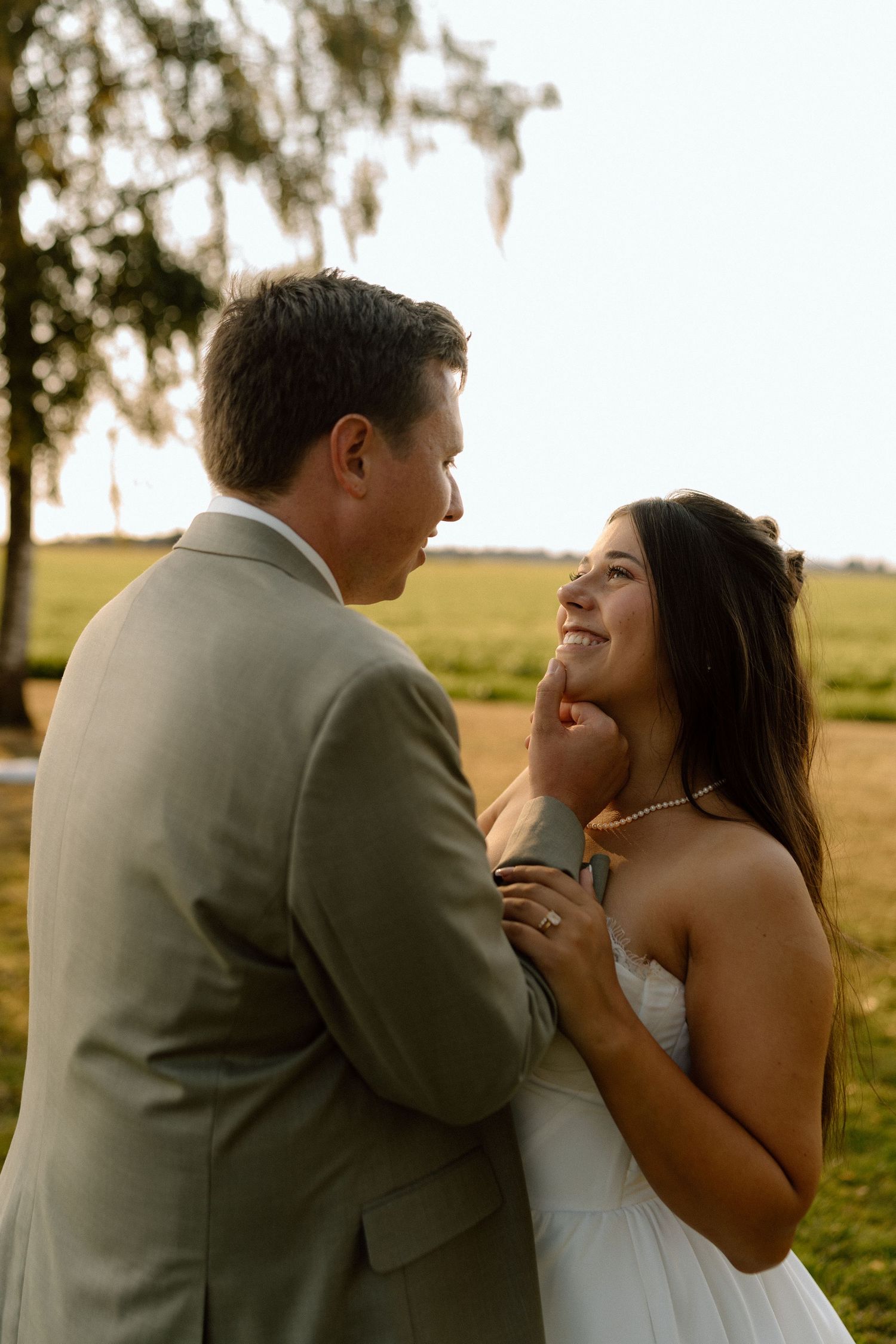a bride and groom looking at each other