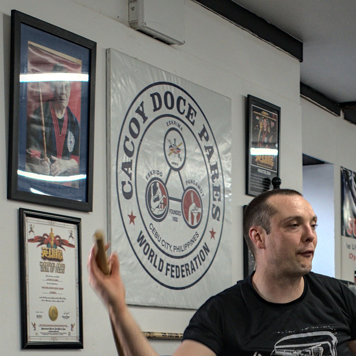 An instructor speaks at a Cacoy Doce Pares World Federation martial arts school.