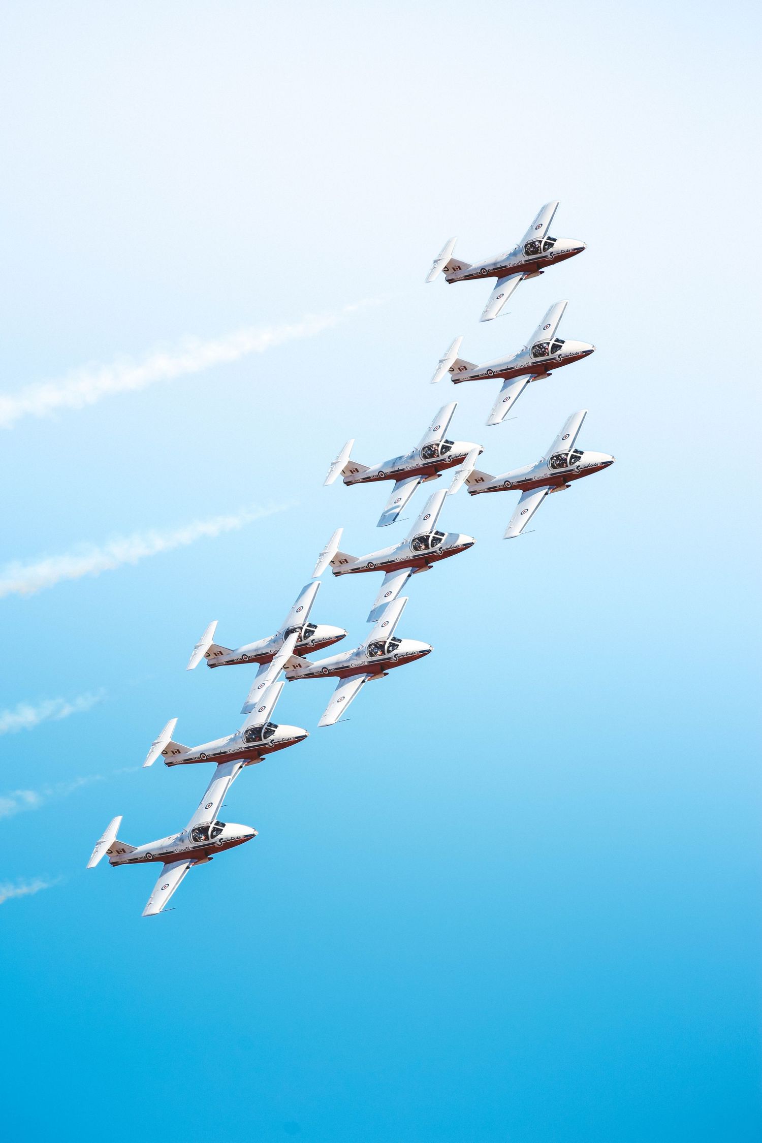 Photos from the 2025 McMinnville Air Show in McMinnville Oregon featuring the SnowBirds flying in formation over the crowd.