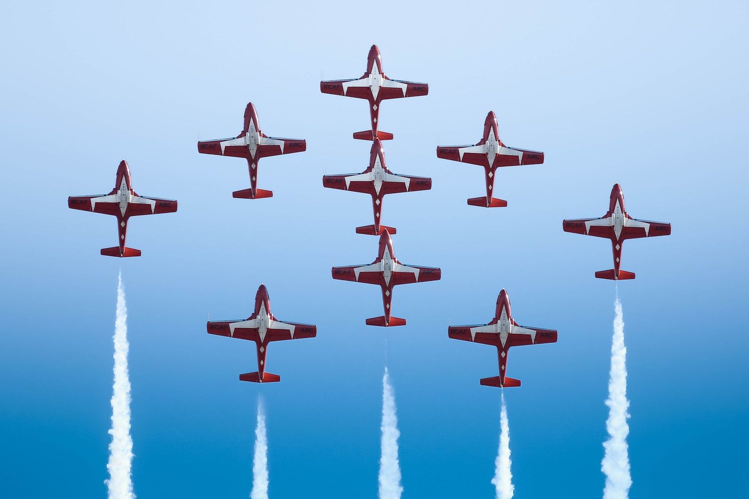 Photos from the 2025 McMinnville Air Show in McMinnville Oregon featuring the SnowBirds flying in formation over the crowd.