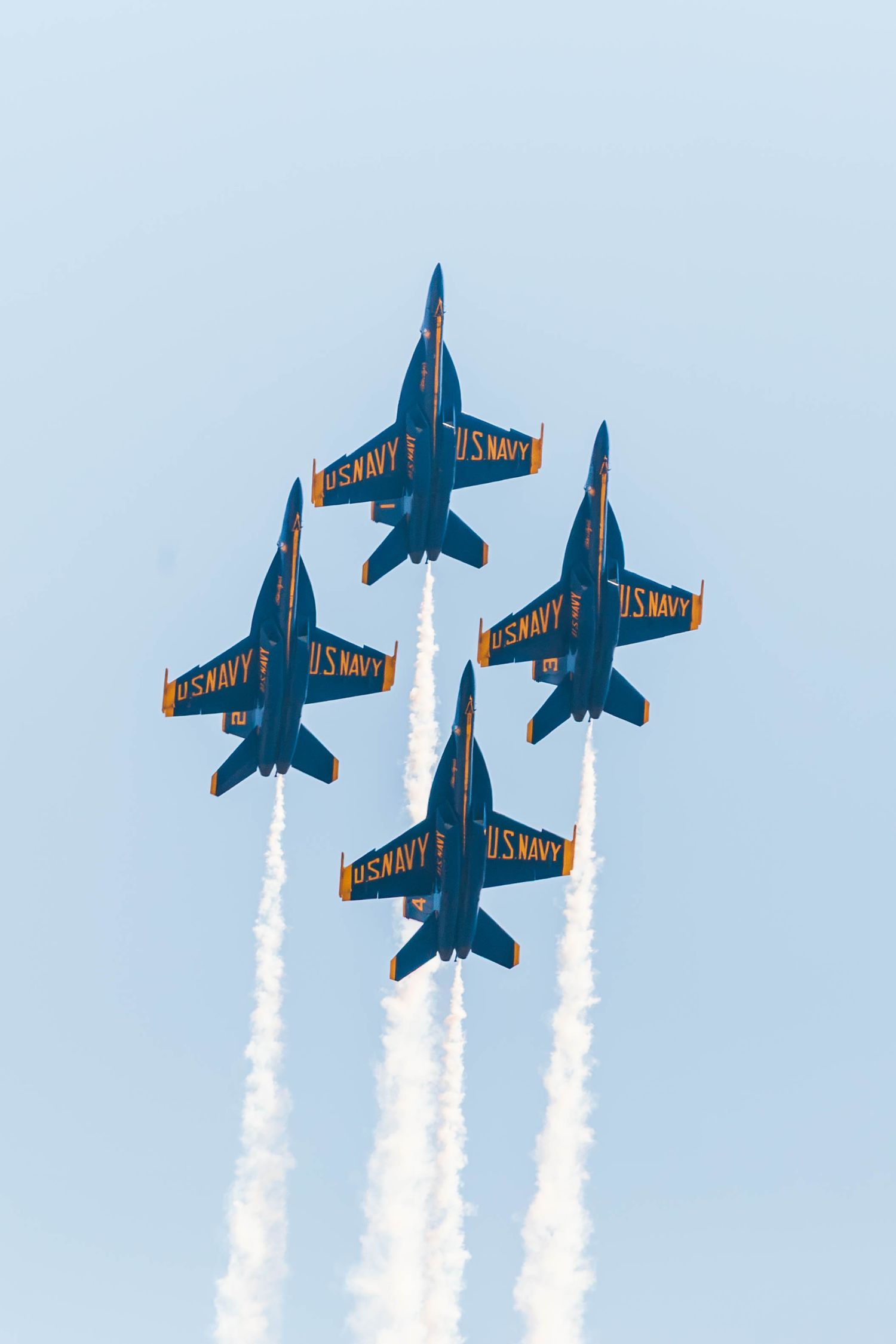 U.S. Navy Blue Angels F/A-18 Super Hornets performing aerial maneuvers at the Oregon International Air Show in McMinnville, Oregon.