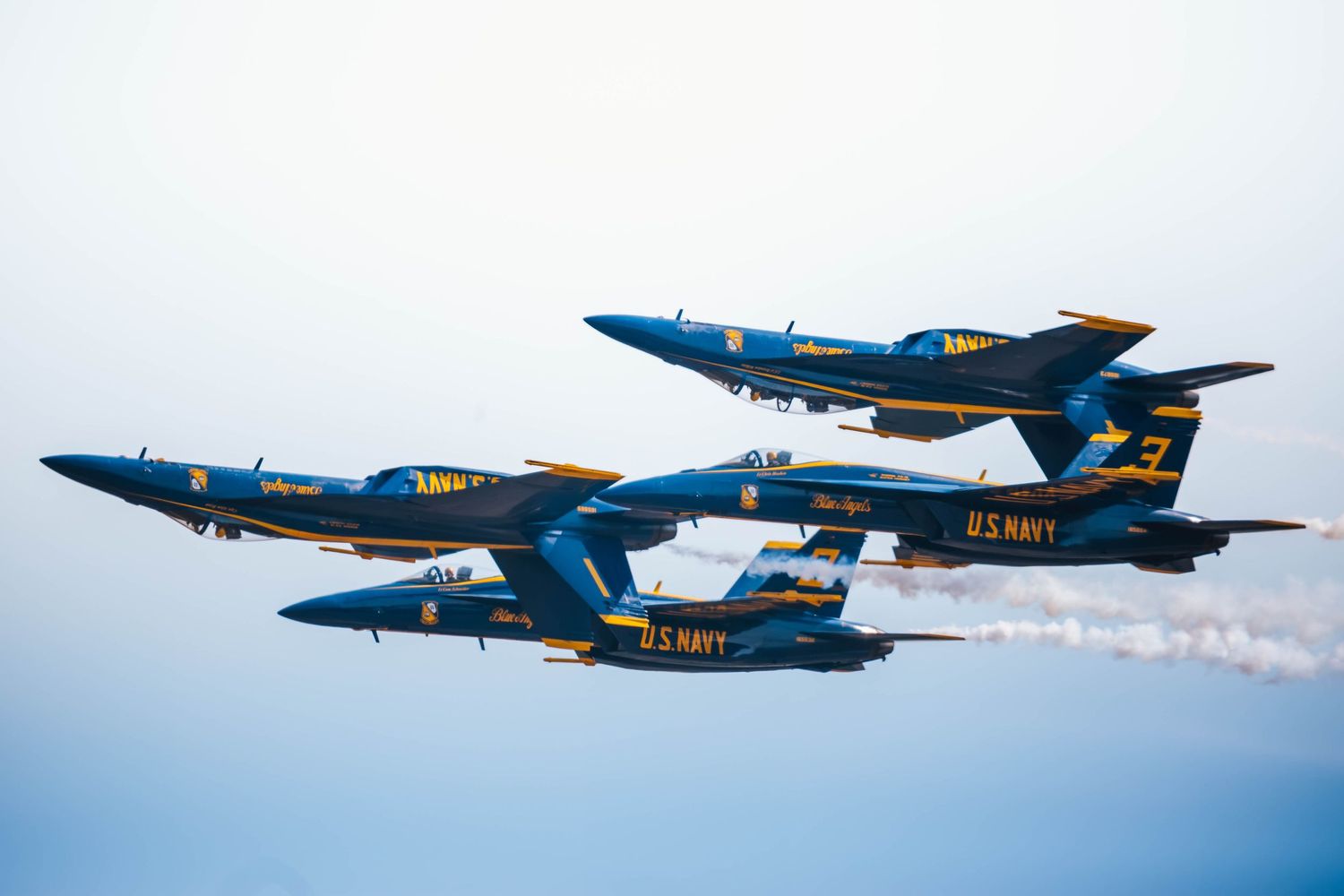 U.S. Navy Blue Angels F/A-18 Super Hornets performing aerial maneuvers at the Oregon International Air Show in McMinnville, Oregon.