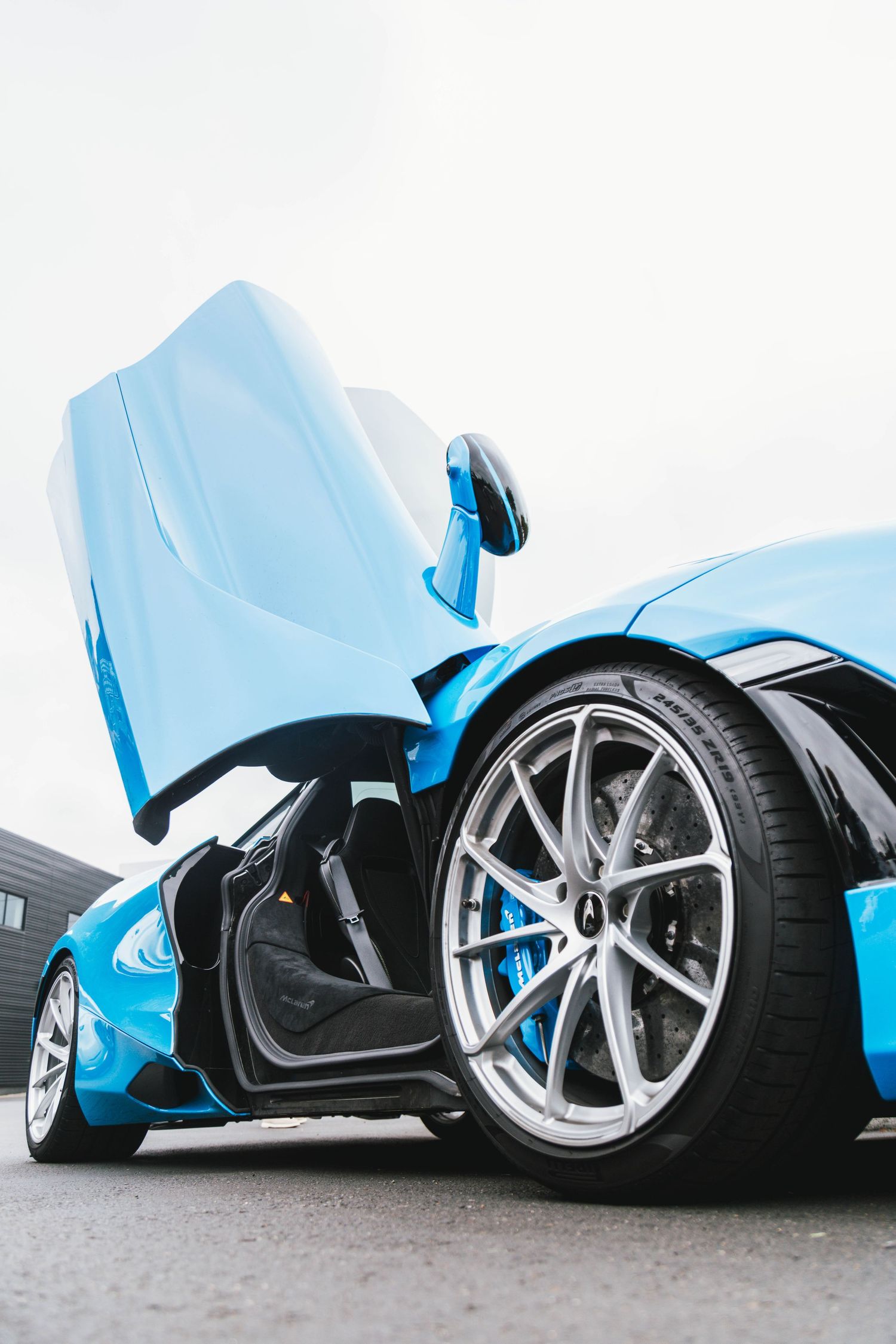 Mclaren 720s Door photo in blue at Porsche Beaverton Cars and Coffee.