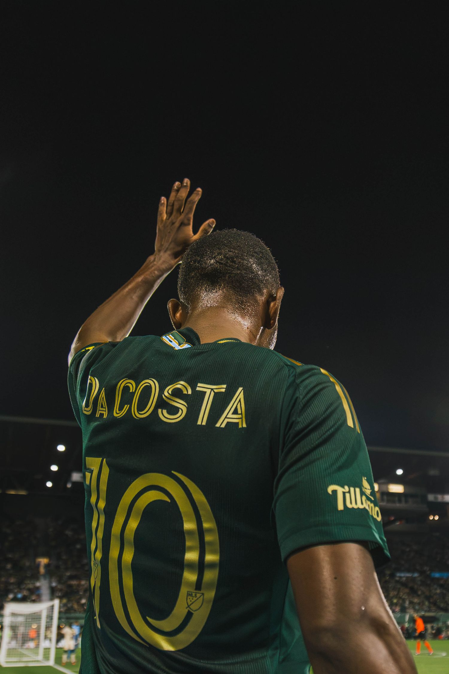 Portland Timbers players competing against Atlanta United FC during a Major League Soccer match at Providence Park in Portland, Oregon.