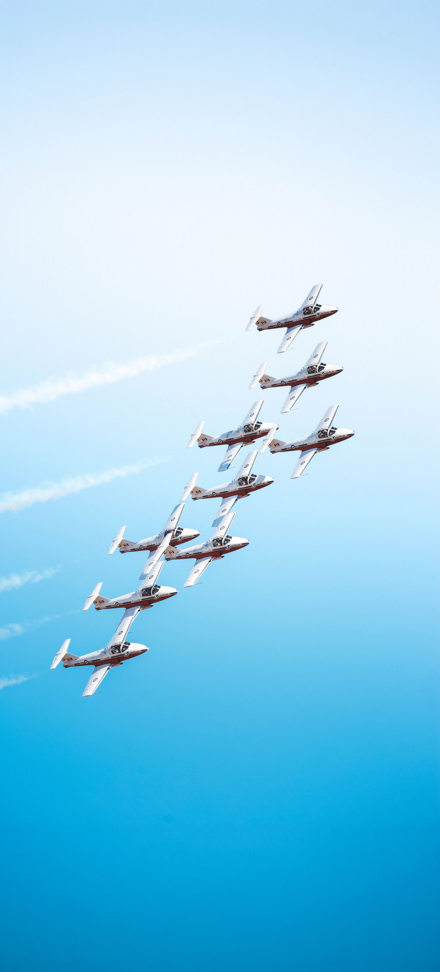 Photos from the 2025 McMinnville Air Show in McMinnville Oregon featuring the SnowBirds flying in formation over the crowd.