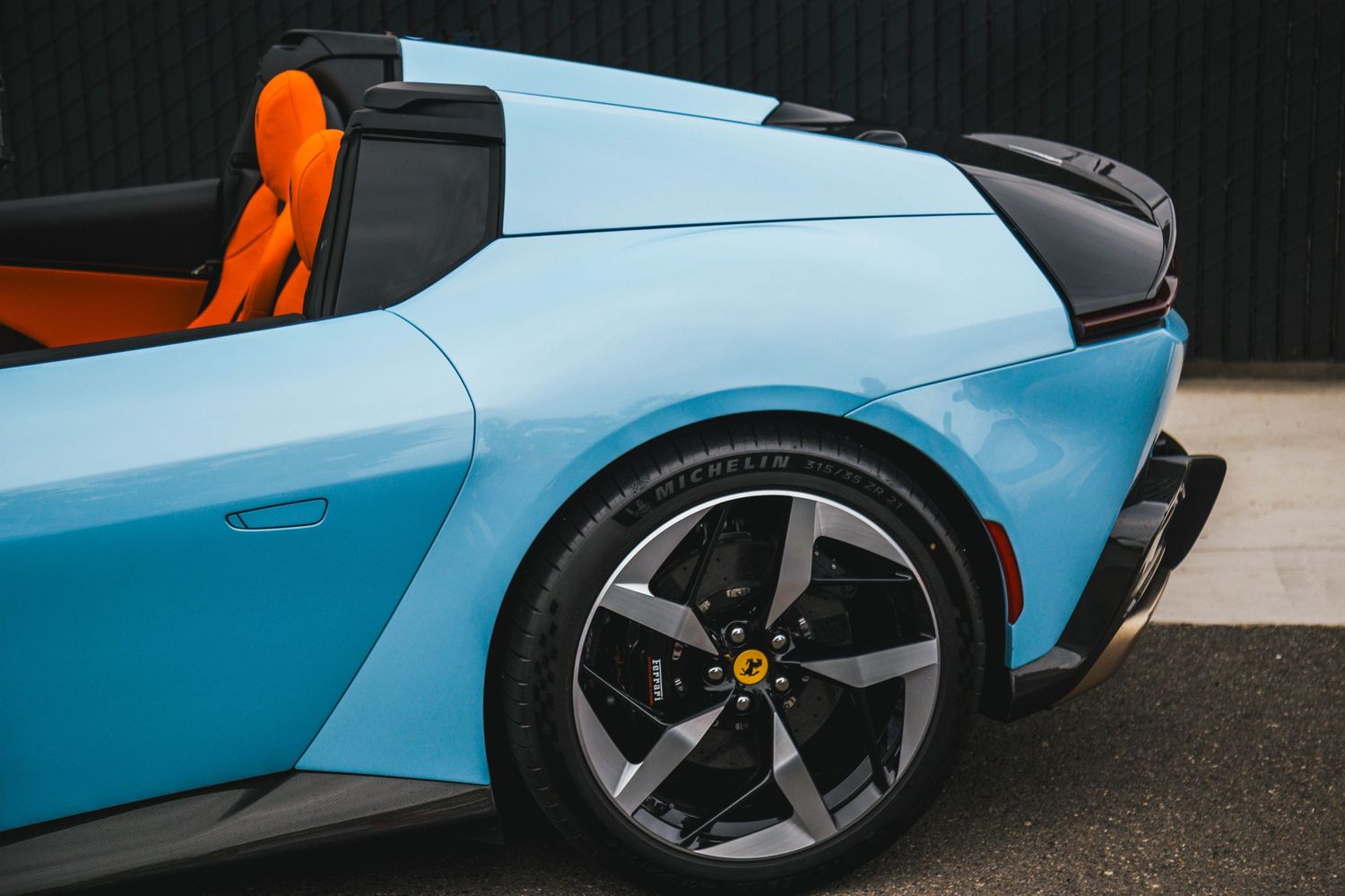 Ferrari 12Cilindri with Blue exterior over orange interior at Portland Cars and Coffee.