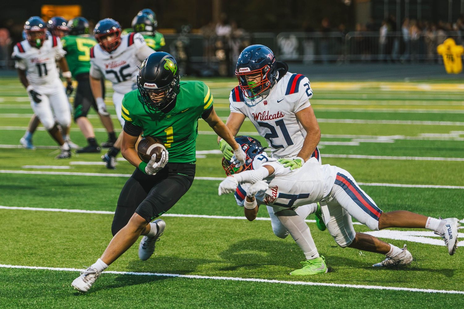 West Linn Lions football players competing during a high school football game in West Linn, Oregon.