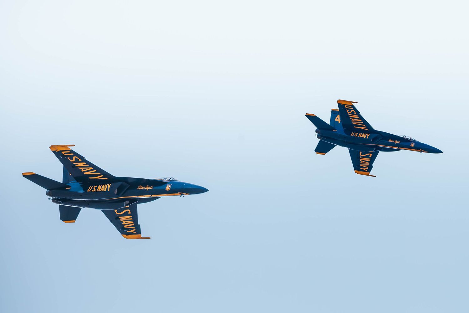 U.S. Navy Blue Angels F/A-18 Super Hornets performing aerial maneuvers at the Oregon International Air Show in McMinnville, Oregon.