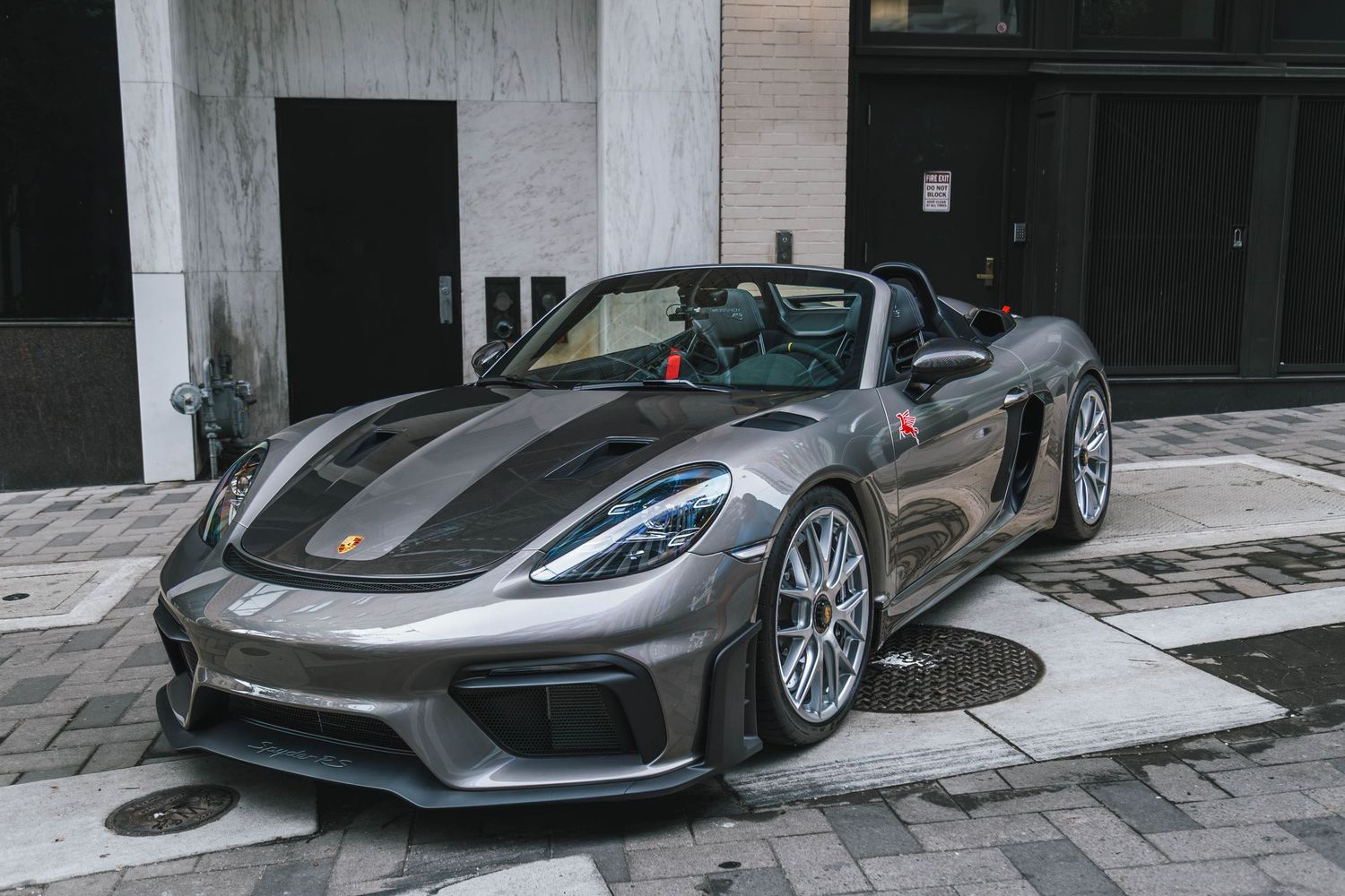 Porsche 718 GT4 Spyder RS in grey parked in a urban environment downtown Portland Oregon