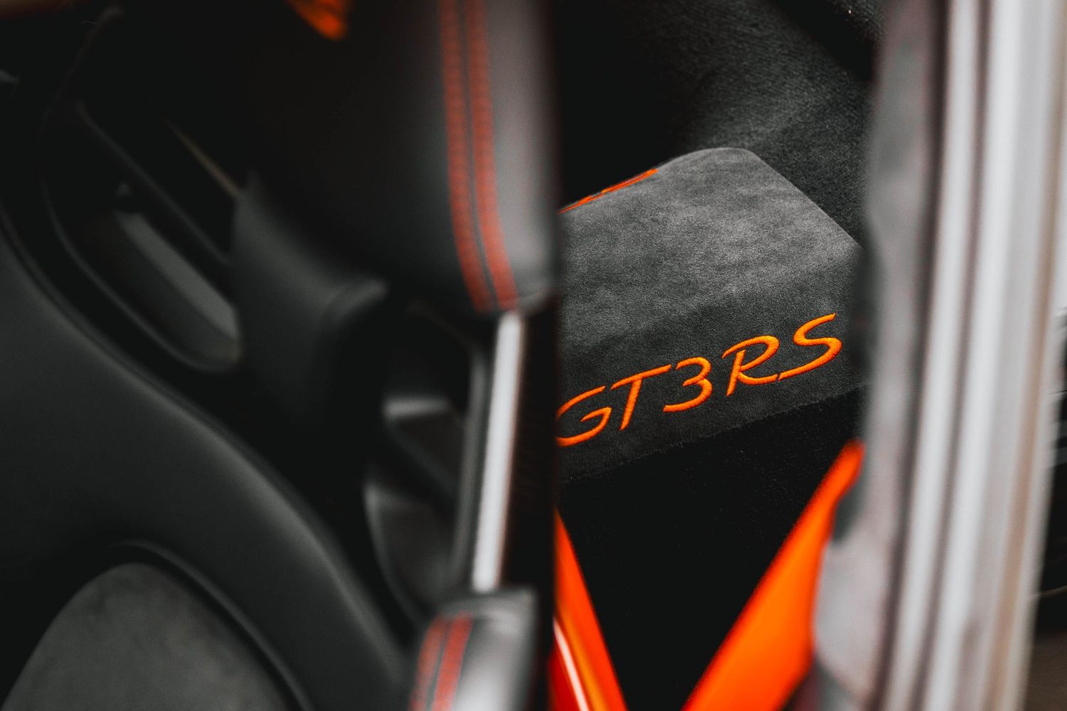 Porsche GT3 RS with orange contrast stitching.