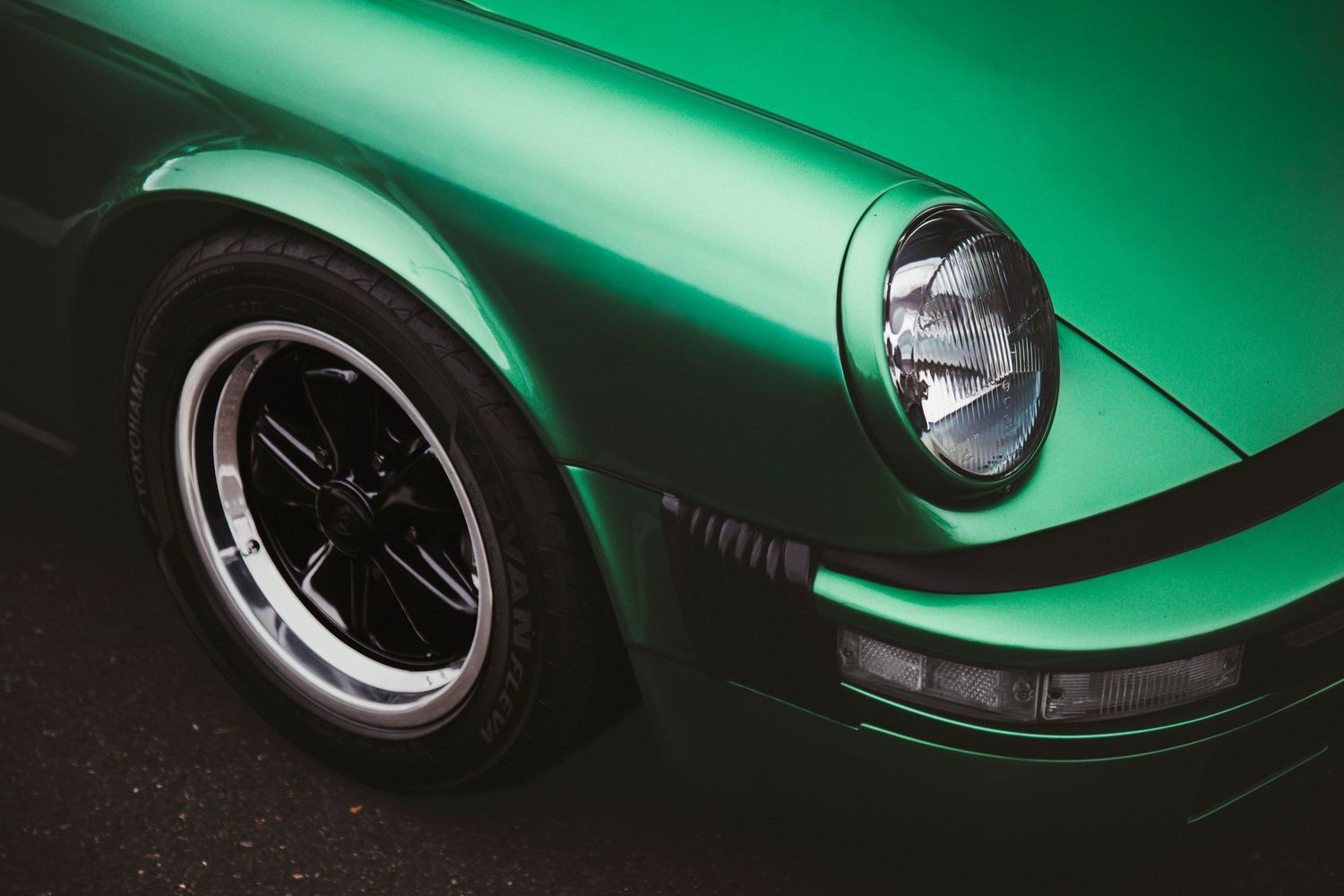 Porsche 911 green front and headlight shot