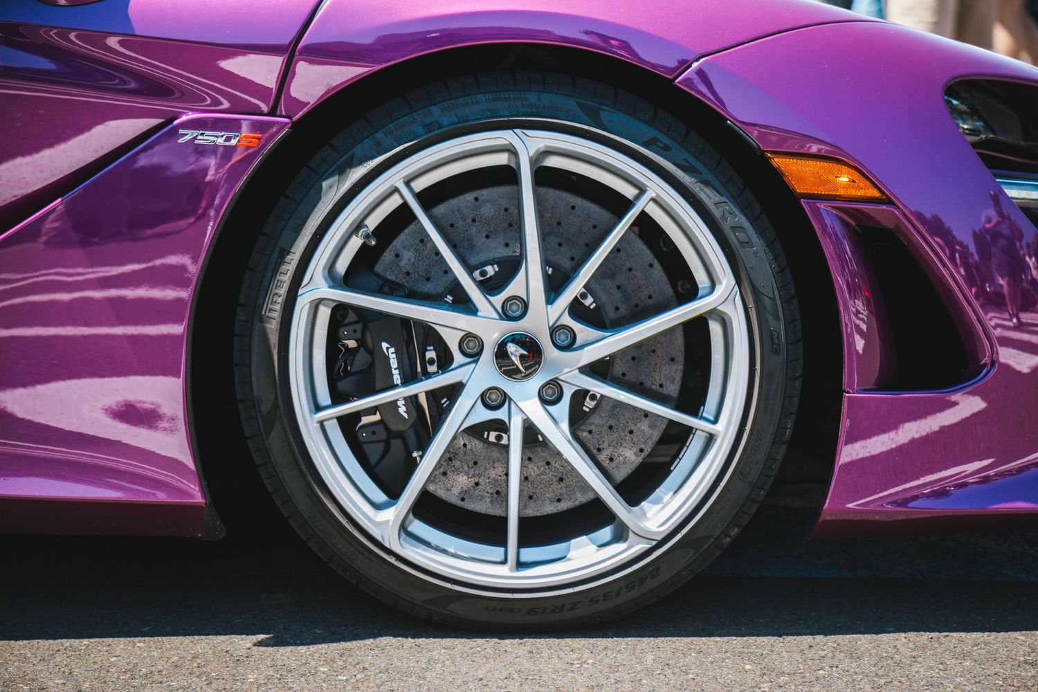 Mclaren 750s In Purple, wheel shot with black brake calipers.