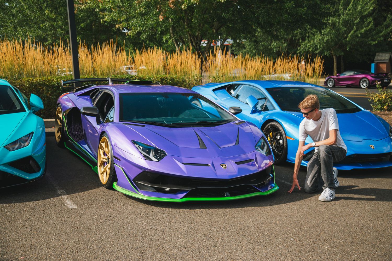 Miles Butler in front of a purple Lamborghini Aventador SVJ