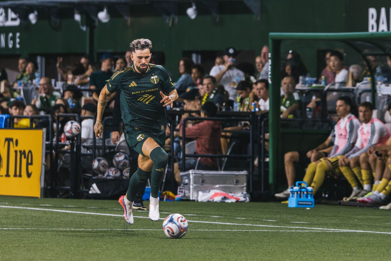 Portland Timbers players competing against St. Louis CITY SC during a Major League Soccer match at Providence Park in Portland, Oregon.