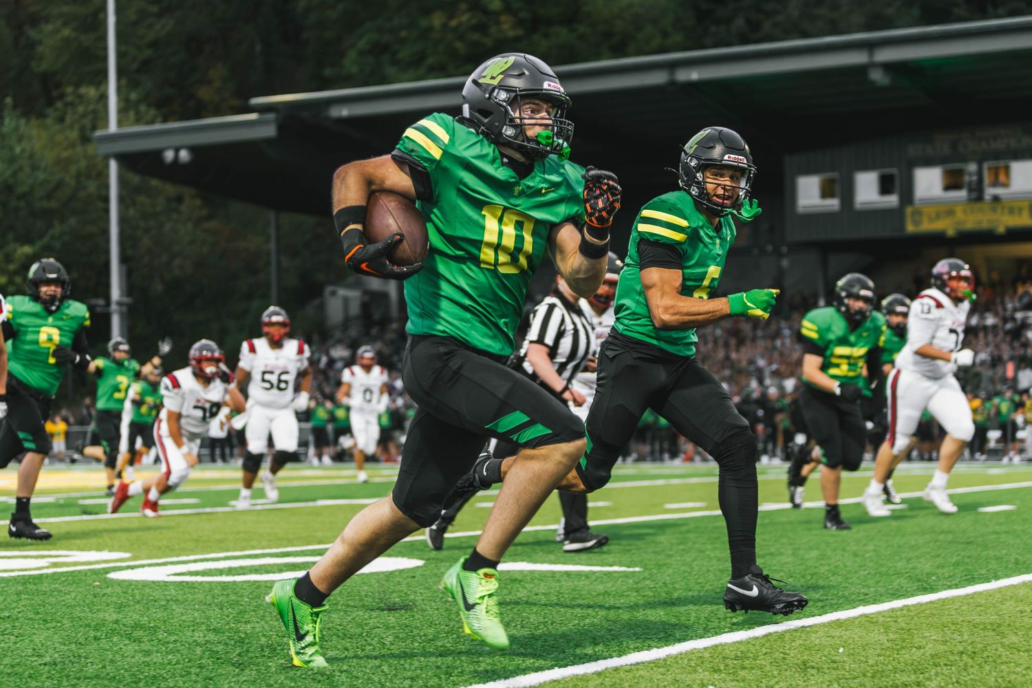 West Linn Lions football players competing during a high school football game in West Linn, Oregon.