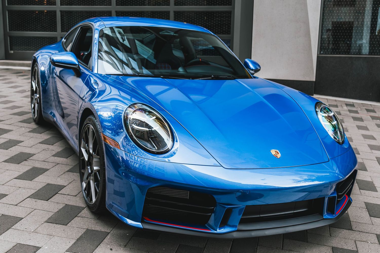 992.2 Porsche 911 in Blue parking in a urban environment downtown Portland Oregon.