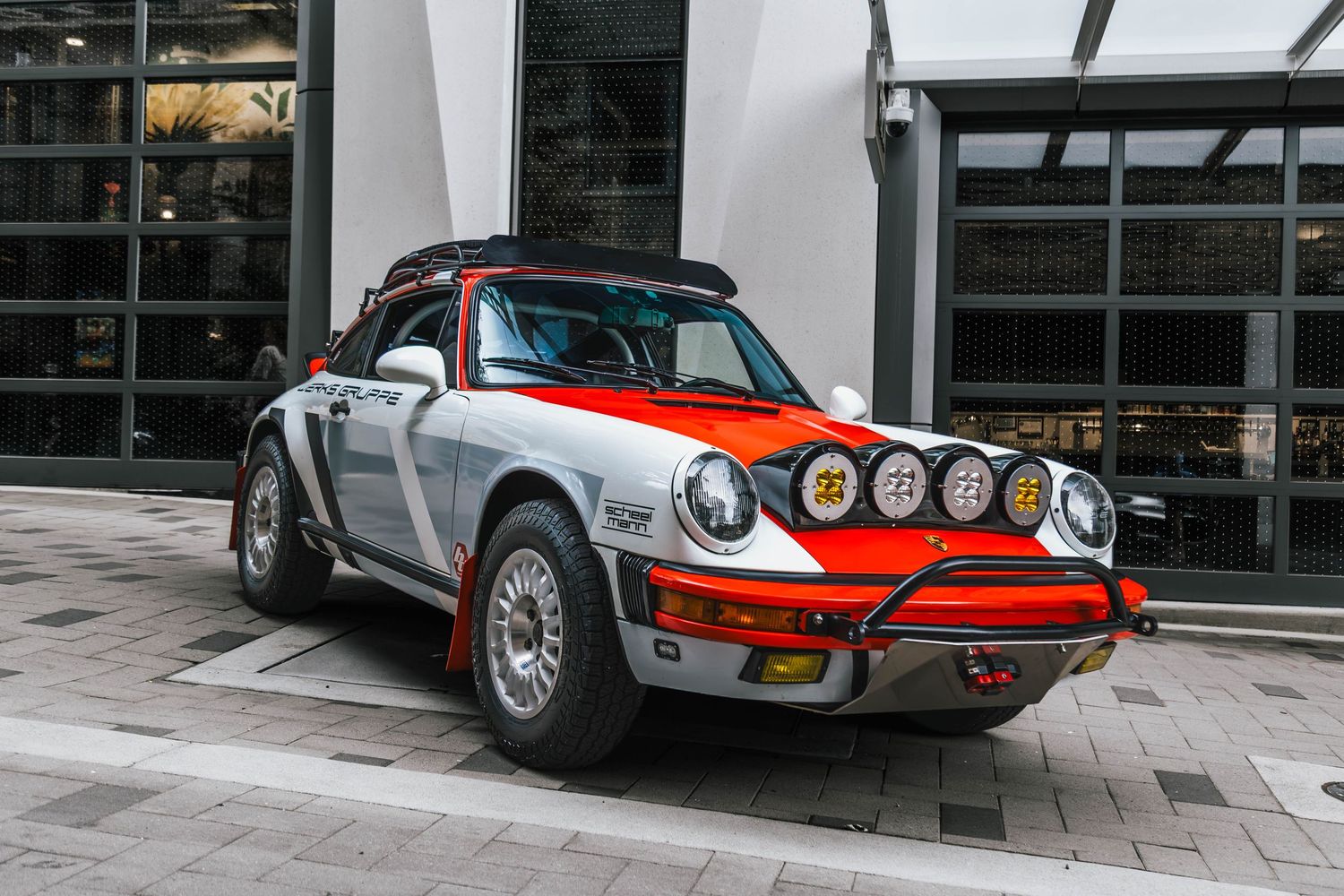 Porsche 911 Safari Build parked in a urban environment.
