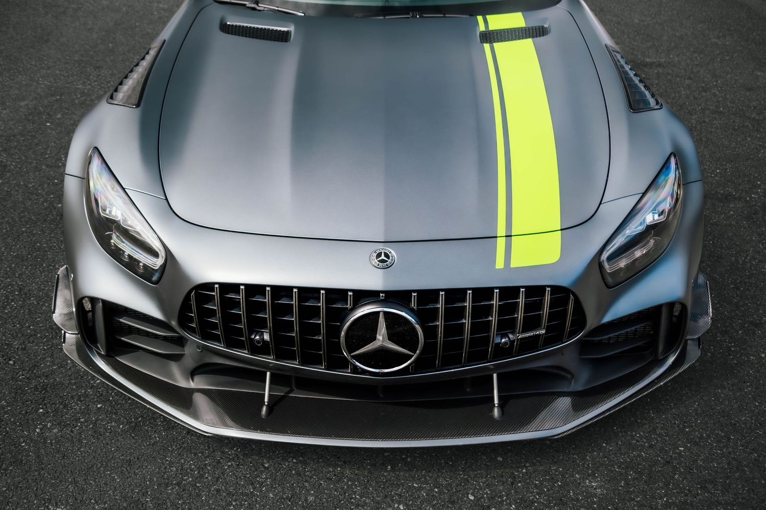 Mercedes AMG GT front end photo, grey with green stripe.