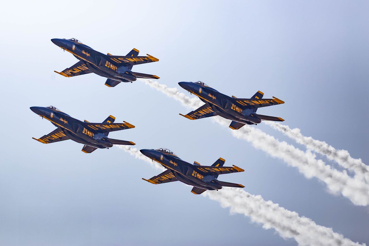 U.S. Navy Blue Angels F/A-18 Super Hornets performing aerial maneuvers at the Oregon International Air Show in McMinnville, Oregon.