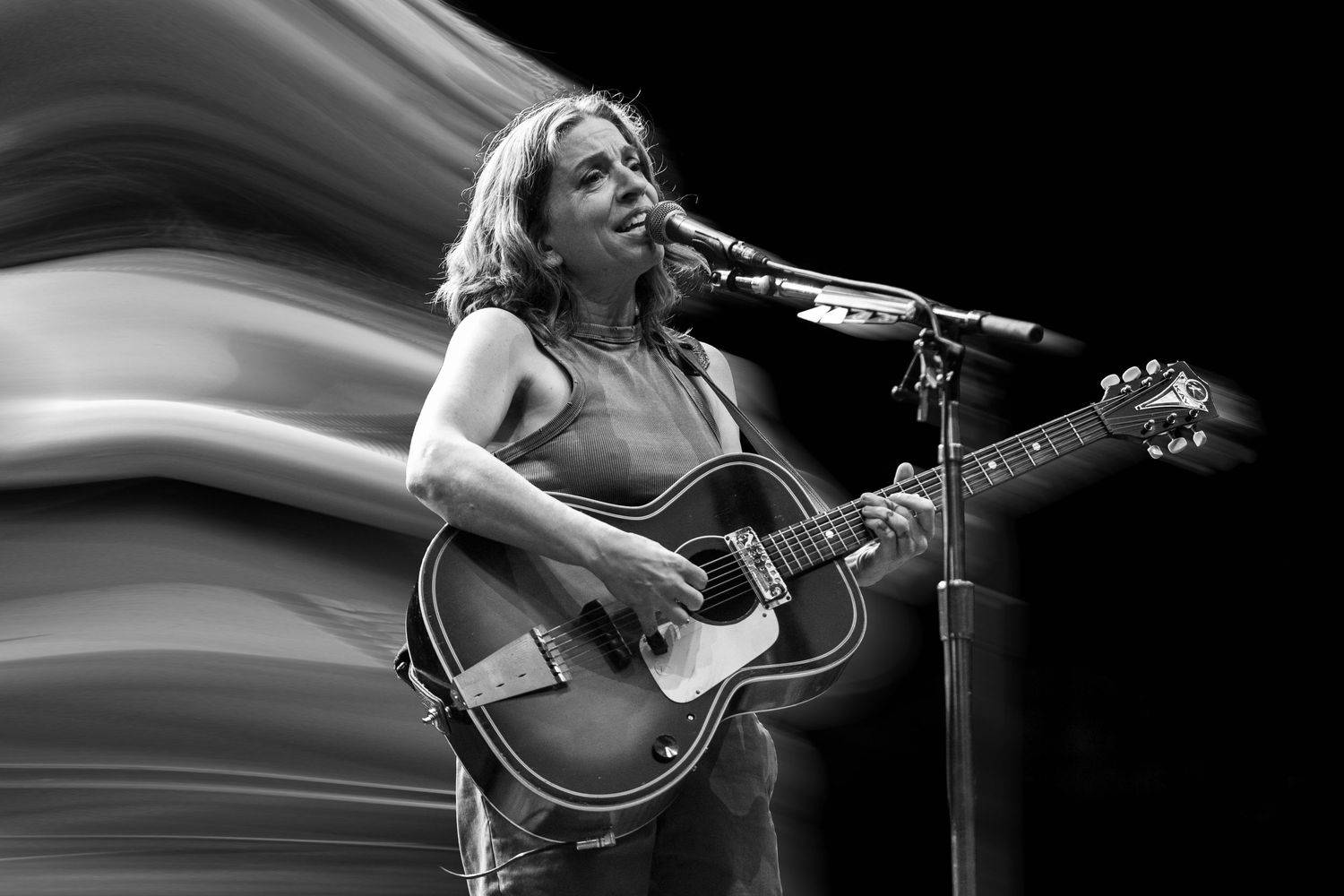 Concert photography featuring Ani DiFranco at Pioneer Courthouse Square in Portland Oregon.