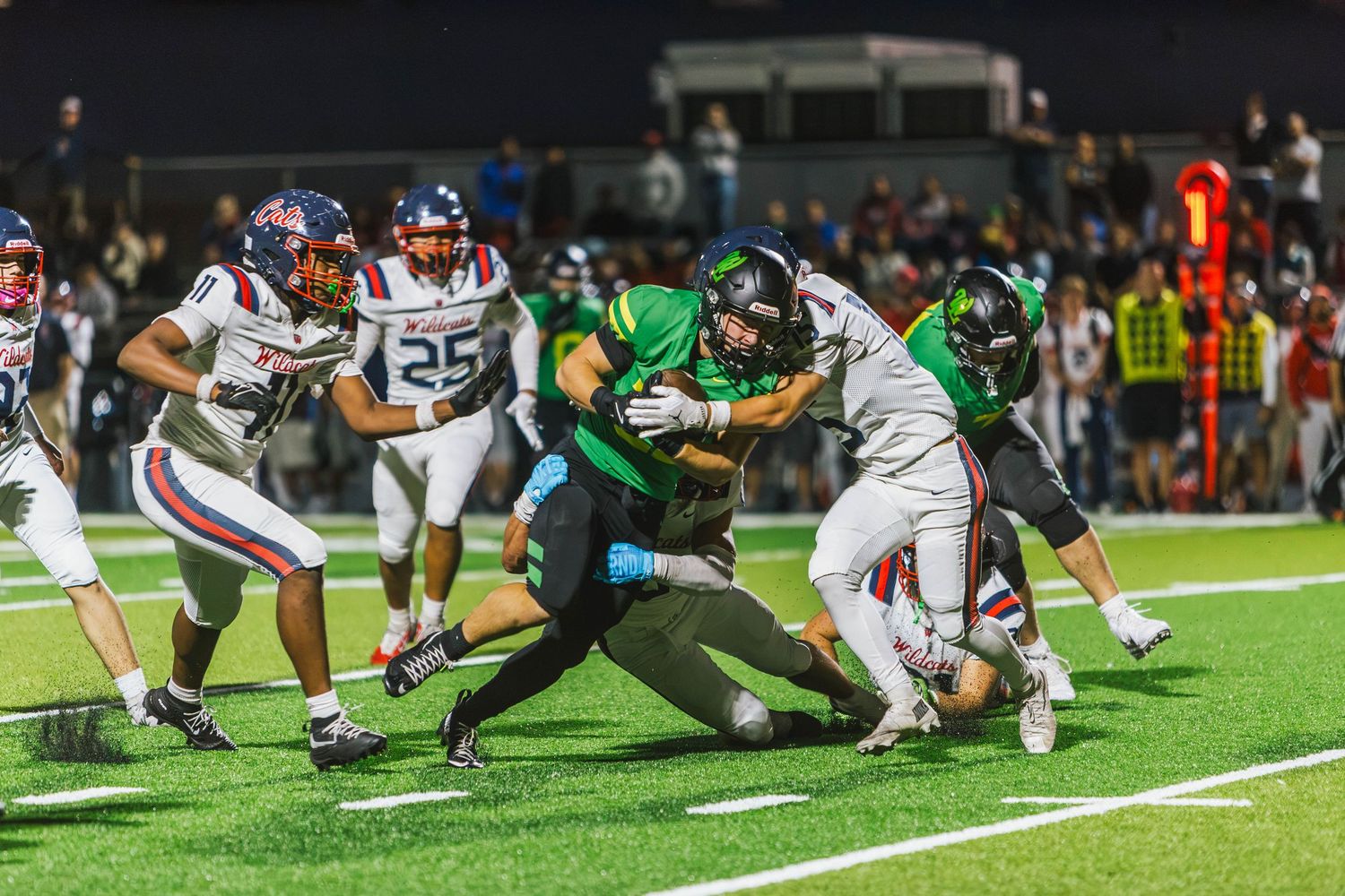 West Linn Lions football players competing during a high school football game in West Linn, Oregon.