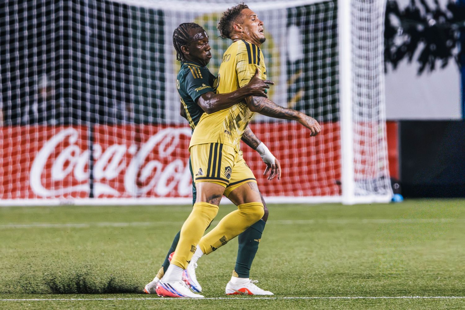 Portland Timbers players competing against St. Louis CITY SC during a Major League Soccer match at Providence Park in Portland, Oregon.