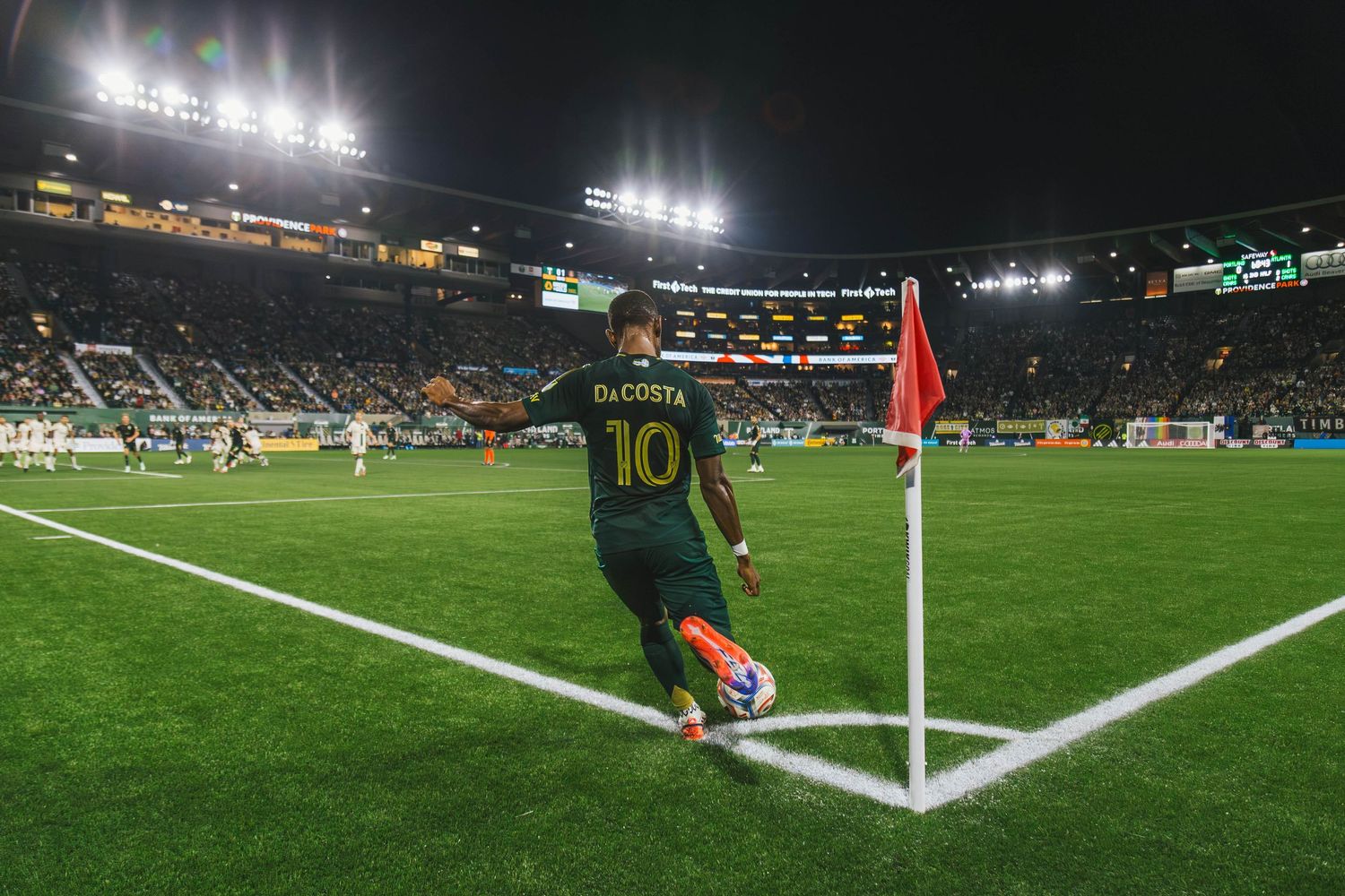 Portland Timbers players competing against Atlanta United FC during a Major League Soccer match at Providence Park in Portland, Oregon.