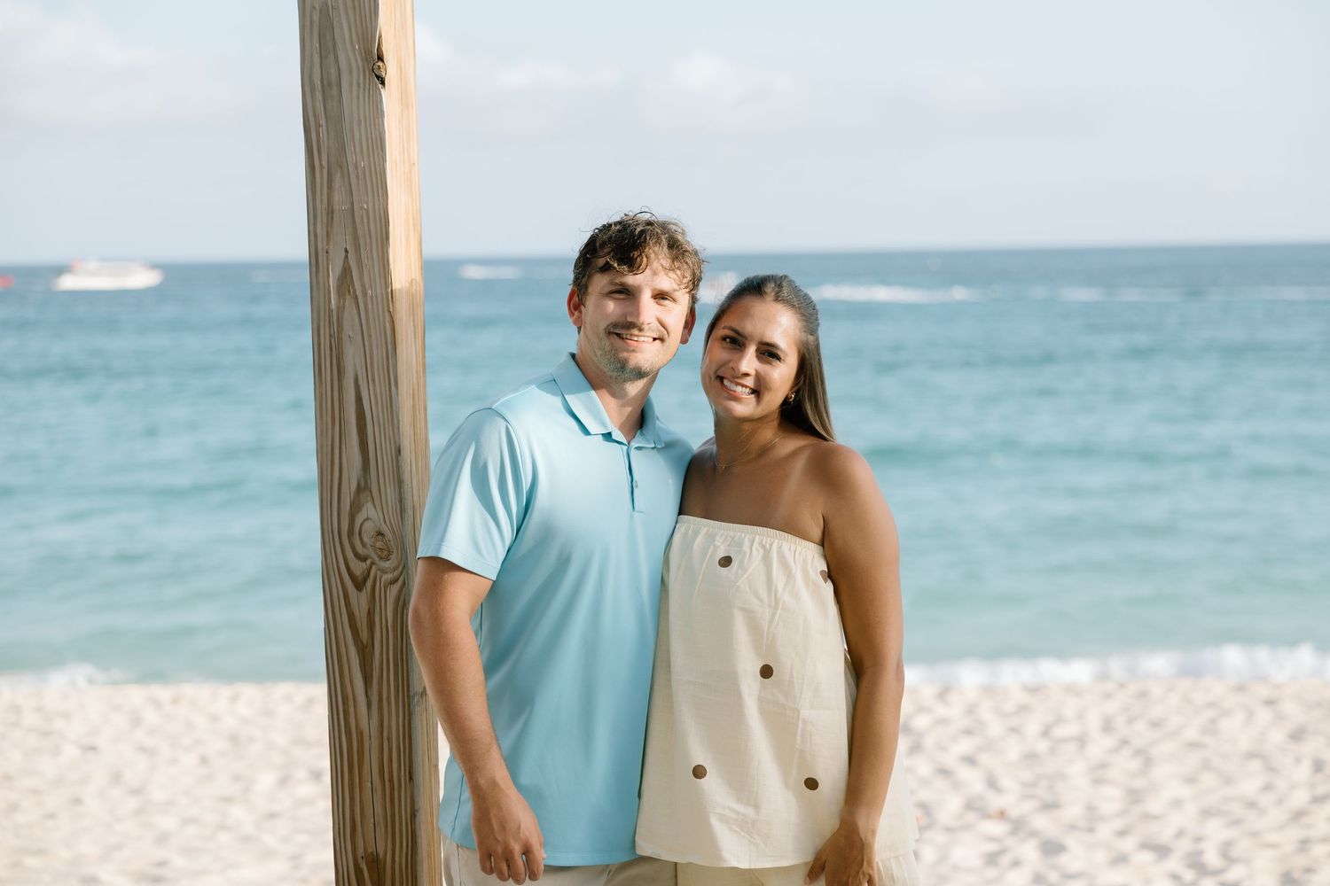 Girl and Guy in front of a beach