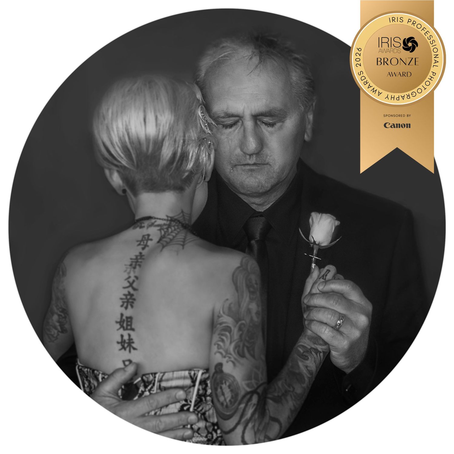 Black and white portrait of a father and daughter dance at a wedding, dad is shedding a tear. IRIS Bronze Award winner by Charly Baty.