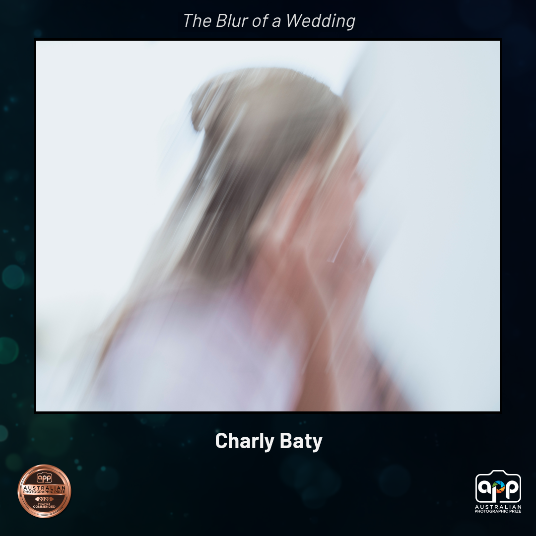 Award-winning blurred motion wedding photo by Charly Baty capturing a bride in ethereal movement.