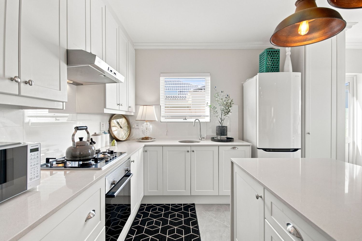 Modern white kitchen real estate photography Sunningdale Cape Town