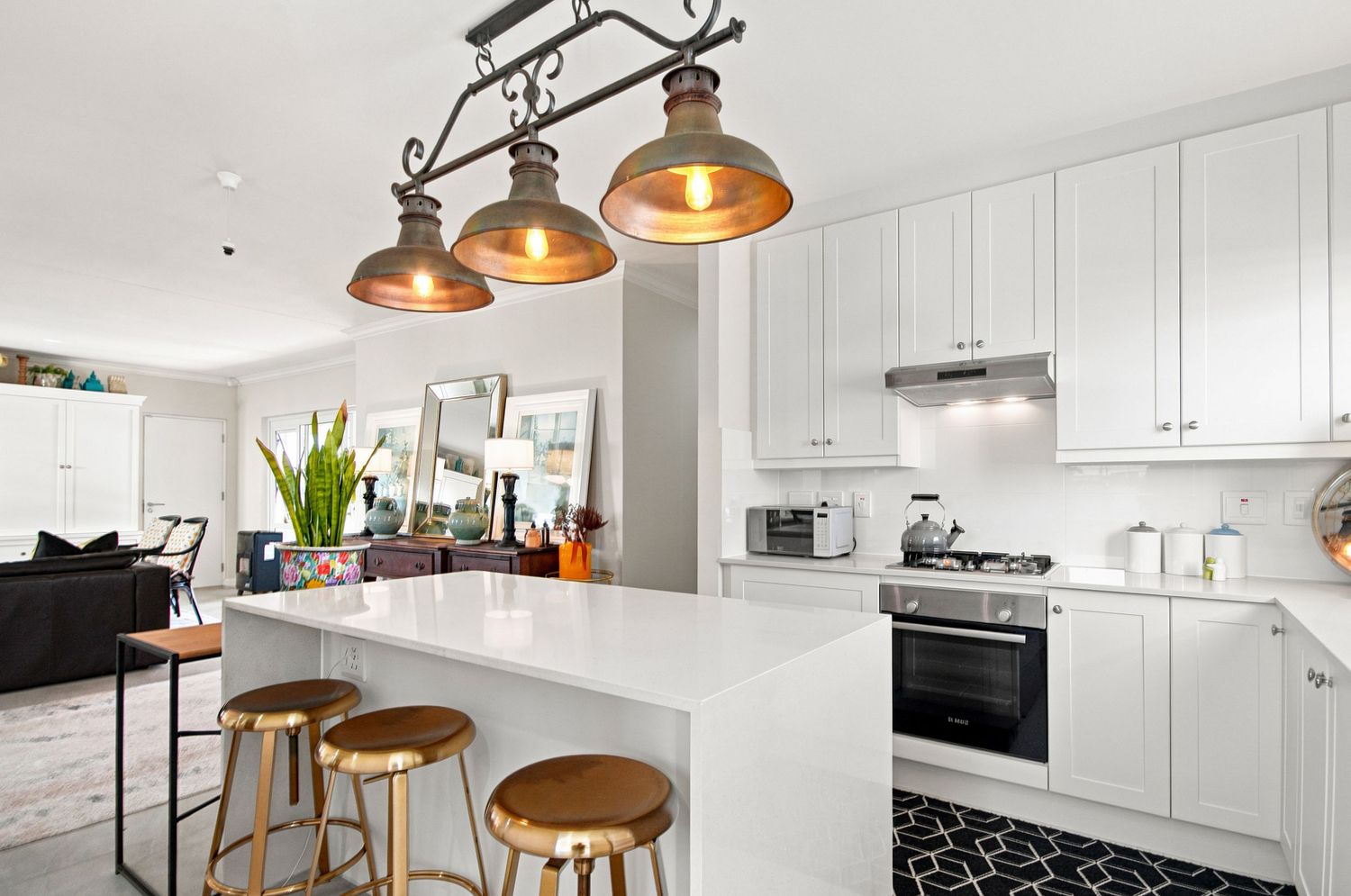 Contemporary kitchen island with pendant light fixtures real estate interior